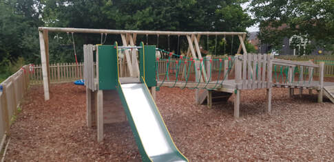 A picture of the smaller climbing frame and the swings